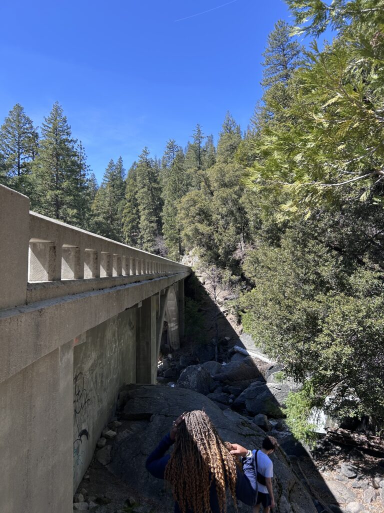walking towards cascade creek situated beneath an underpass 