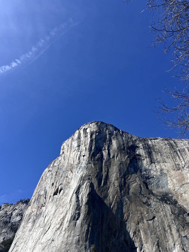 the gray granite rock face of El Capitan in Yosemite National Park